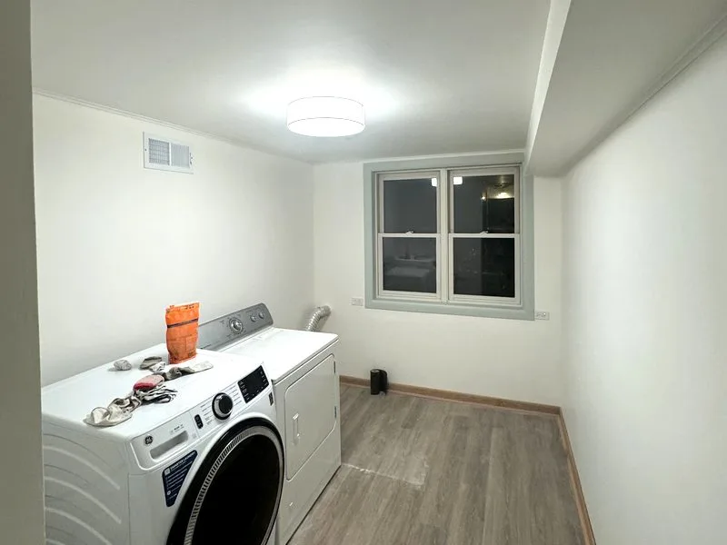Laundry room after preparation and painting with smooth white walls